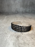 Black crystal cuff bracelet in a gunmetal-tone frame, handmade by LUXORI